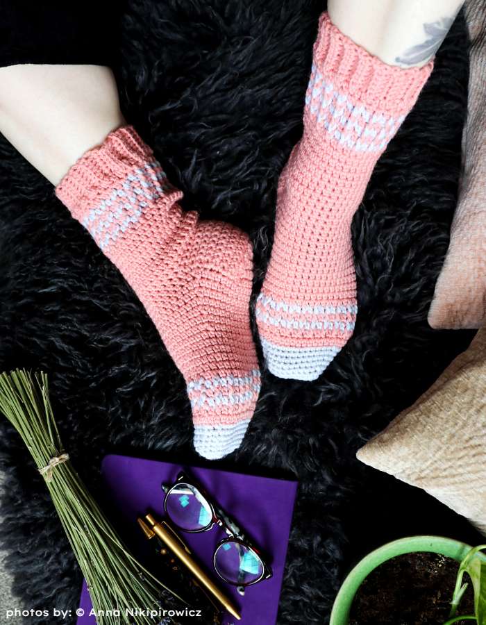 Lumi Socks on a black carpet
