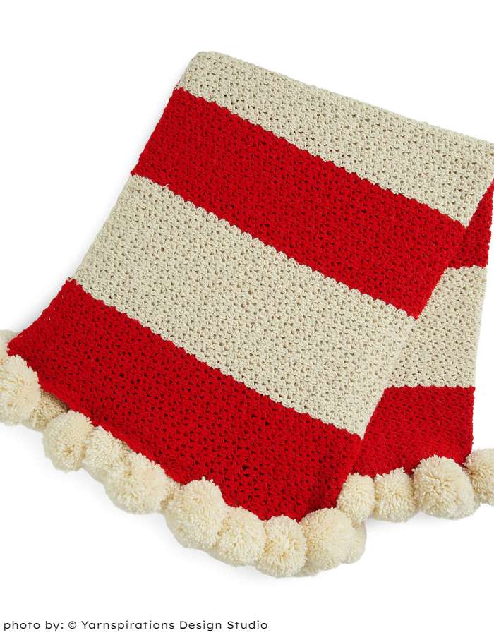 Red Heart Peppermint and Pompoms Throw on white background